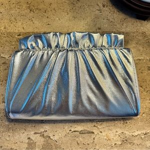 Silver oyster clutch